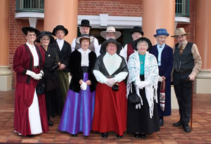 Museum volunteers dressed in colonial costume